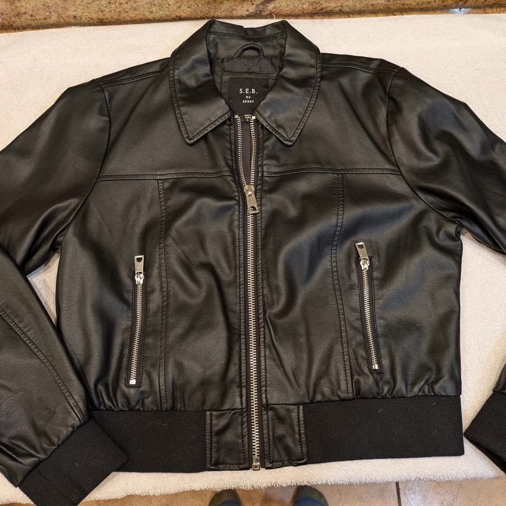 Faux Leather Black Jacket, Bomber, Sits at the waist, Zipper Pockets.